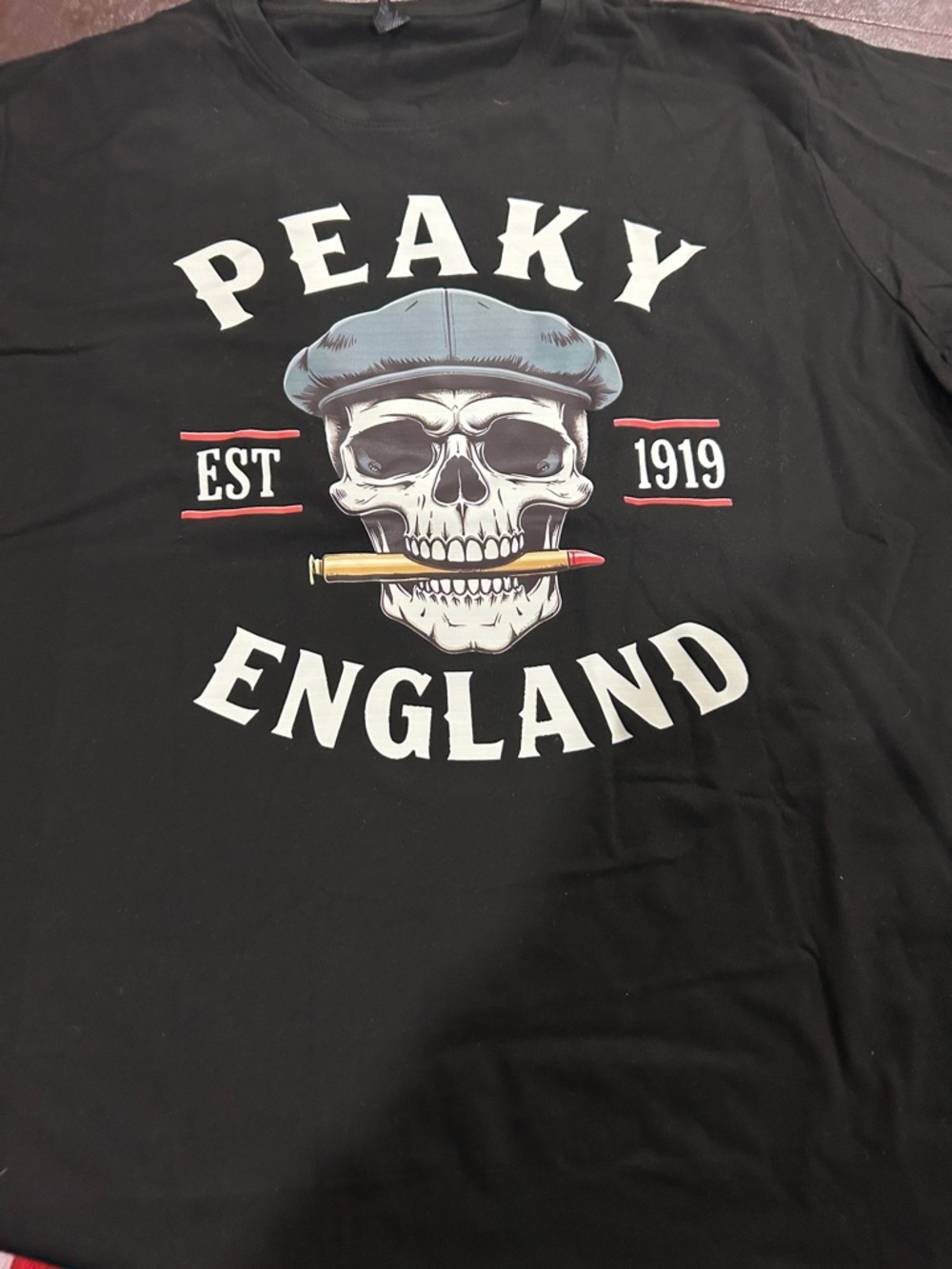 PEAKY BLINDERSBlack Graphic Tee with Skull and Bullet.